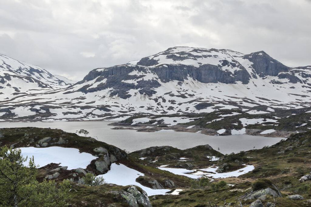 Telemark landscape in Norway. Haukelifjell mountain area. Snow in July. - Fotoğraf, Görsel