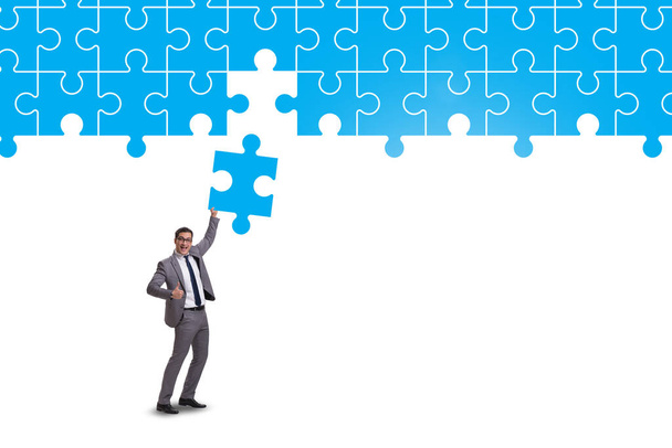 Concept of businessman with missing jigsaw puzzle piece - Photo, Image