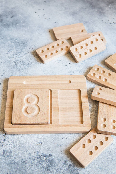 Wooden counting and writing trays - learning resource for educating littles on number writing, fine motor skills, hand eye coordination, mathematical skills. Wooden kids toys. Counting math game - Photo, Image