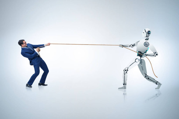 Ανταγωνισμός μεταξύ ανθρώπων και ρομπότ στην έννοια της διελκυστίνδας - Φωτογραφία, εικόνα