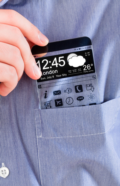 Smartphone con una pantalla transparente en un bolsillo de camisa
. - Foto, imagen