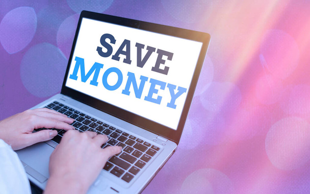 Writing note showing Save Money. Business photo showcasing to budget or put money aside for the future or emergency Modern gadgets white screen under colorful bokeh background. - Photo, Image