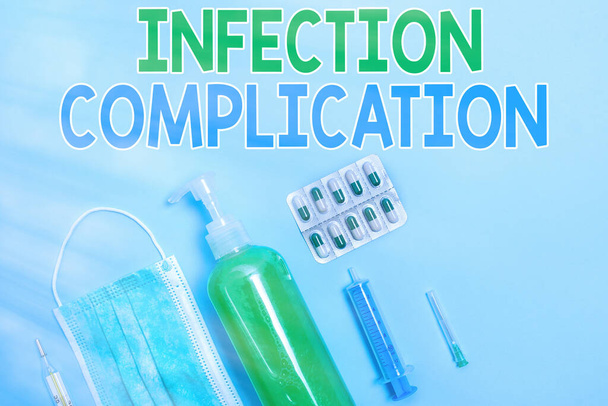 Writing note showing Infection Complication. Business photo showcasing unwanted reaction resulted from an immunosuppression Primary medical precautionary equipments for health care protection. - Photo, Image