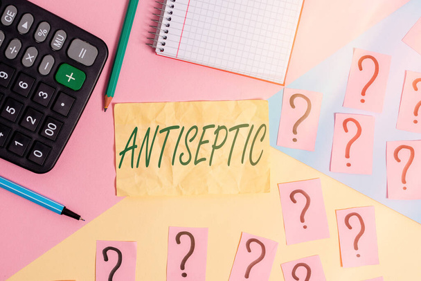 Writing note showing Antiseptic. Business photo showcasing antimicrobial agents that delays or completely eliminate the microorganism Mathematics stuff and writing equipment above pastel colours - Fotografie, Obrázek