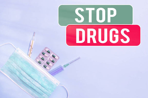 Text sign showing Stop Drugs. Conceptual photo put an end on the dependence on substances such as heroin or cocaine Primary medical precautionary equipments for health care protection. - Valokuva, kuva