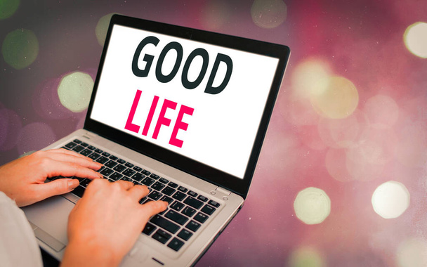 Conceptual hand writing showing Good Life. Business photo showcasing living in comfort and luxury with few problems or worries Modern gadgets white screen under colorful bokeh background. - Photo, Image