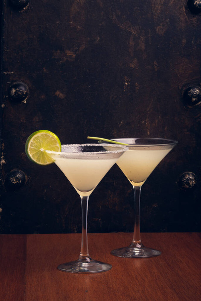 Margaritas on rustic background with space for text. Vertical shot - Foto, imagen