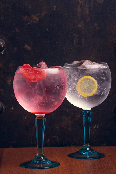 Gin tonic on rustic background with space for text. Vertical shot. - Foto, imagen
