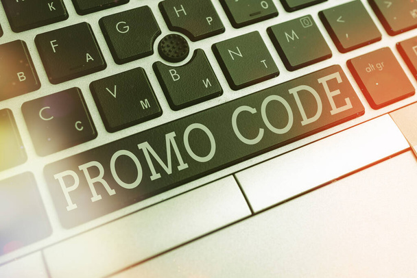 Writing note showing Promo Code. Business photo showcasing letters or numbers that allows getting a discount on something Pc keyboard key with empty note paper above background copy space. - Fotografie, Obrázek