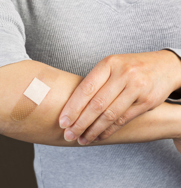 Bandage over Cut on Arm - Φωτογραφία, εικόνα