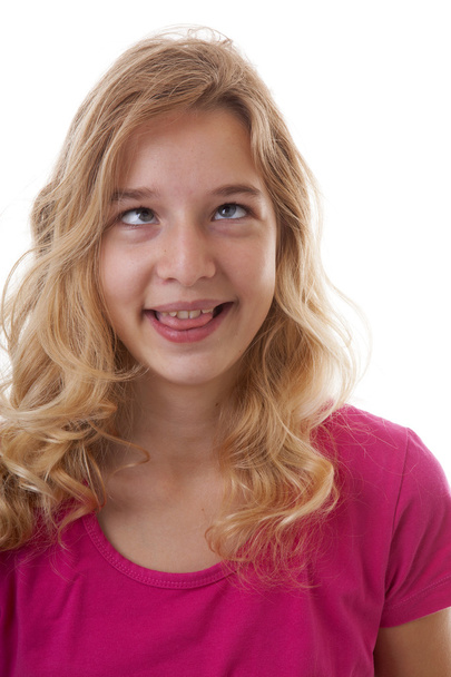 girl makes funny face in closeup over white background - Photo, Image