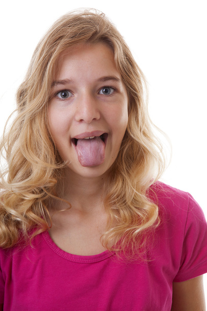 girl makes funny face in closeup over white background - Fotografie, Obrázek