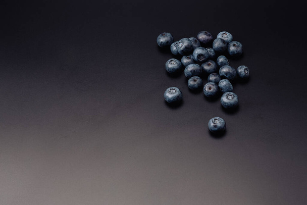 Fresh organic blueberries isolated on black background with copy space for text - Photo, Image