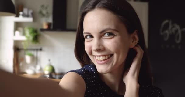 Beautiful woman use smartphone records video smiling posing having fun - Video