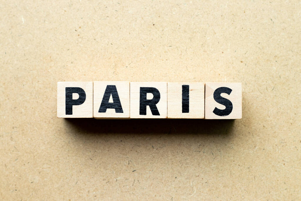 Letter block in word Paris on wood background - Фото, изображение