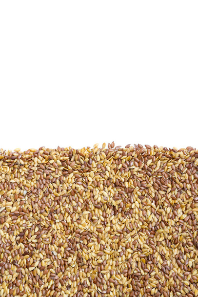  Fecha. Sementes mistas de ouro e linhaça marrom, moldura padrão de semente de linho
 - Foto, Imagem