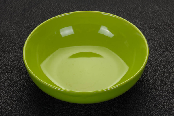 Empty ceramic bowl over black background - Φωτογραφία, εικόνα