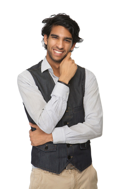 Young man smiling with hand to face - Photo, Image