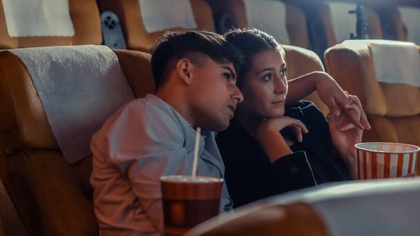 People audience watching movie in the movie theater cinema. Group recreation activity and entertainment concept. - Zdjęcie, obraz