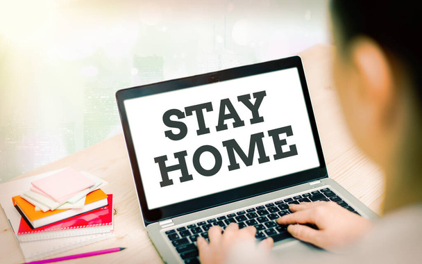 Writing note showing Stay Home Save Lives. Business photo showcasing lessen the number of infected patients by not leaving the house Modern gadgets white screen under colorful bokeh background. - Photo, image