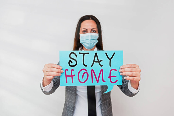 Conceptual hand writing showing Stay Home. Business photo text not go out for an activity and stay inside the house or home Promoting health awareness with precautionary medical equipment. - Φωτογραφία, εικόνα