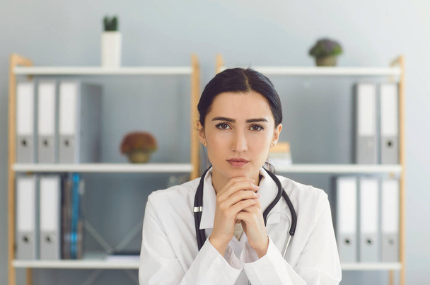 Serious female doctor in medical uniform in clinic - Foto, Imagen