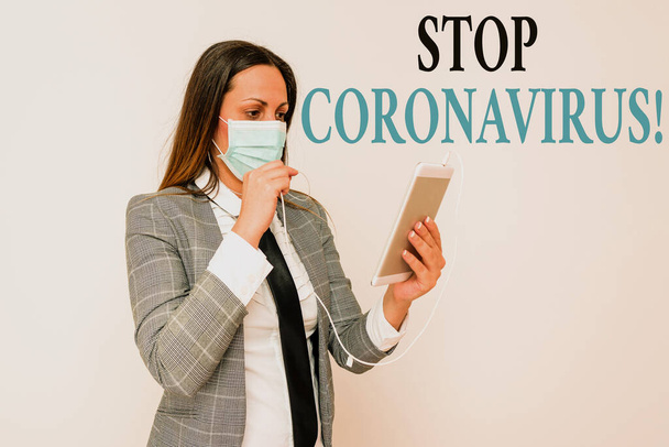 Handwriting text writing Stop Coronavirus. Concept meaning Disease awareness campaign fighting to lessen the COVID19 cases Promoting health awareness with set of medical precautionary equipment. - Photo, Image