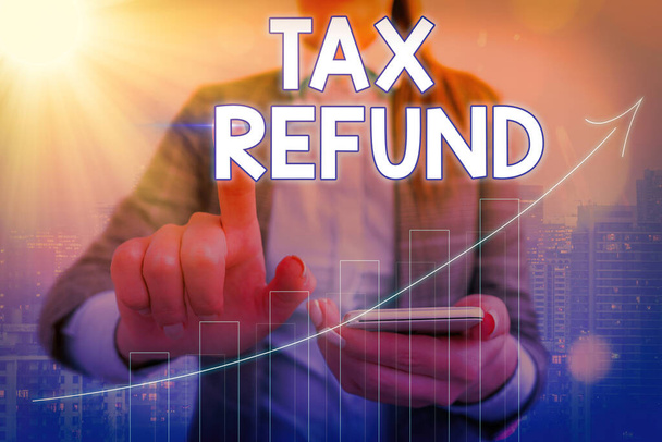 Conceptual hand writing showing Tax Refund. Business photo showcasing excess payment of paid taxes returned to business owners Arrow symbol going upward showing significant achievement. - Photo, Image