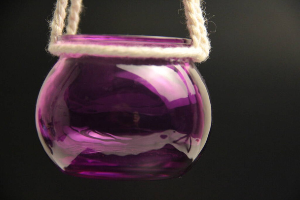 purple glass candle holder hanging on rope - Photo, Image