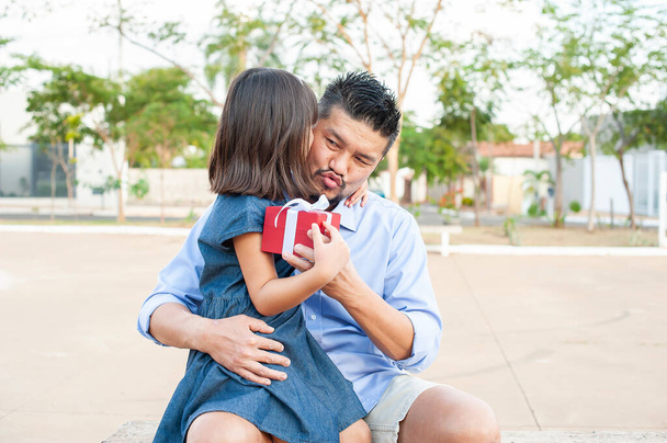 Father and daughter outdoors. Showing affection and love. Father's Day. - Photo, Image