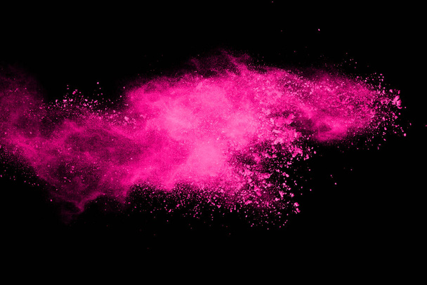 Pink powder explosion on black background. Colored cloud. Colorful dust explode. Paint Holi. - Photo, Image
