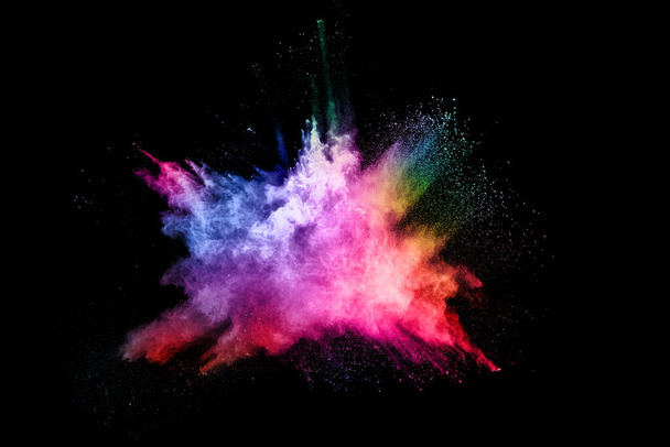 abstract colored dust explosion on a black background.abstract powder splatted background,Freeze motion of color powder exploding/throwing color powder, multicolored glitter texture. - Fotografie, Obrázek