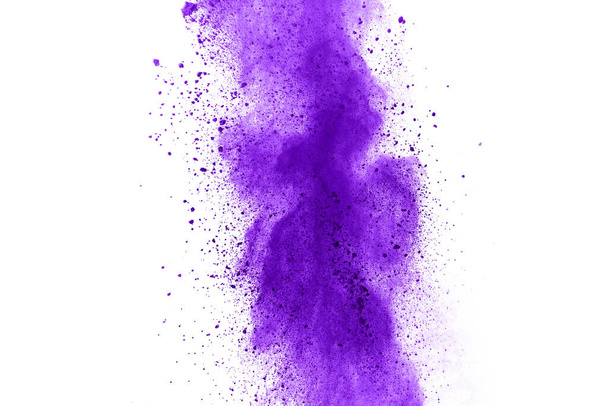 Powder explosion. Closeup of a purple dust particle explosion isolated on white. Abstract background. - Photo, Image