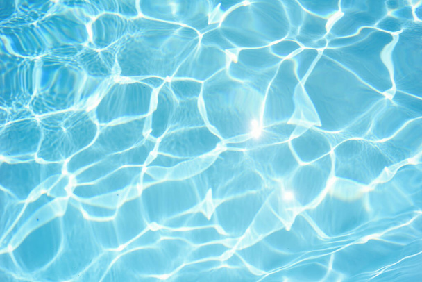 Pool water background with abstract waves and sparkles. - Photo, Image