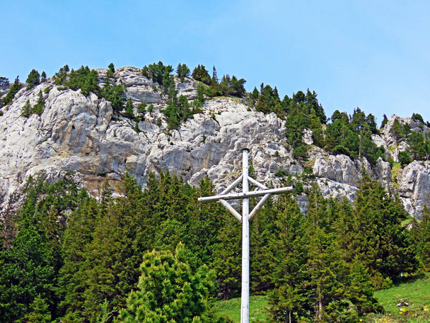 Christian crucifix on the hills and peaks of the Swiss mountain range of Pilatus and in the Emmental Alps, Alpnach - Canton of Obwalden, Switzerland (Kanton Obwalden, Schweiz) - Photo, Image