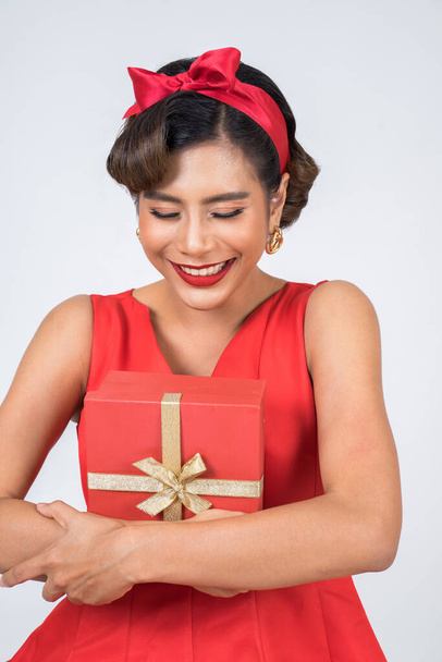 Beautiful happy woman with surprise gift box - Photo, Image