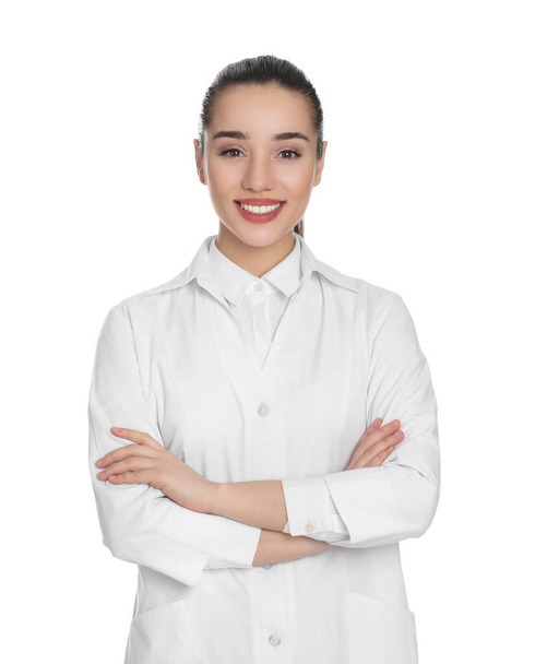 Happy young woman in lab coat on white background - Foto, Bild