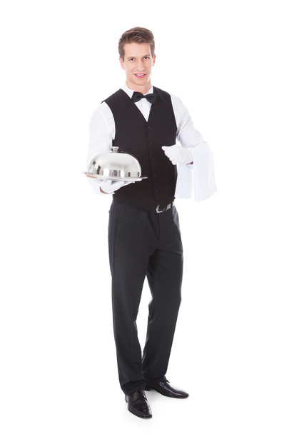 Waiter Holding Cloche Lid Cover - Foto, afbeelding