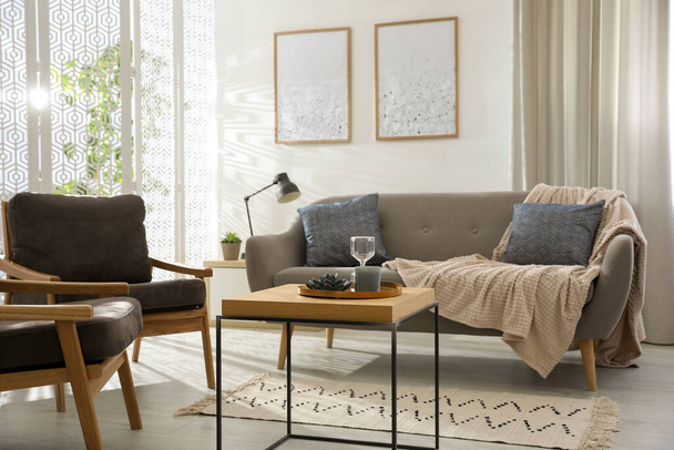 Modern living room interior with comfortable sofa and armchairs - Φωτογραφία, εικόνα