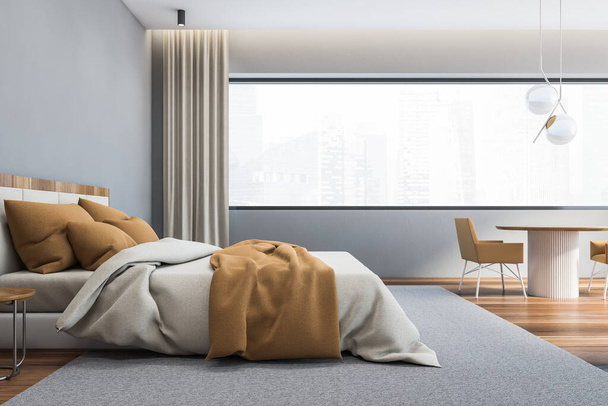 Interior of stylish master bedroom with gray walls, wooden floor, comfortable king size bed with round bedside tables and round table with brown armchairs. Window with blurry cityscape. 3d rendering - Foto, Imagem