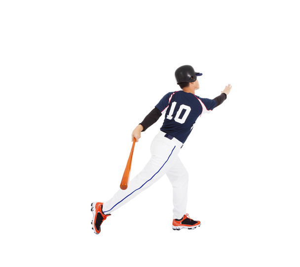honkbalspeler slaan bal met vleermuis en home run - Foto, afbeelding
