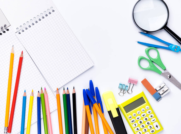 Many different school supplies on white copy space background. Back to school concept. - Valokuva, kuva