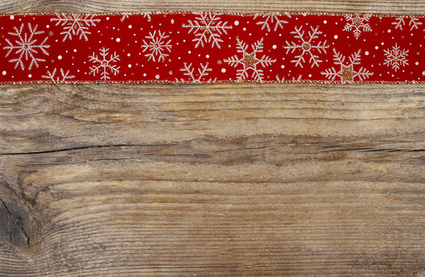 Golden christmas stars on red fabric. Wooden blank board for you - Фото, изображение