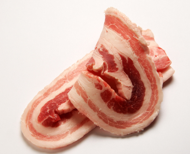Bacon slices on white background - Photo, Image