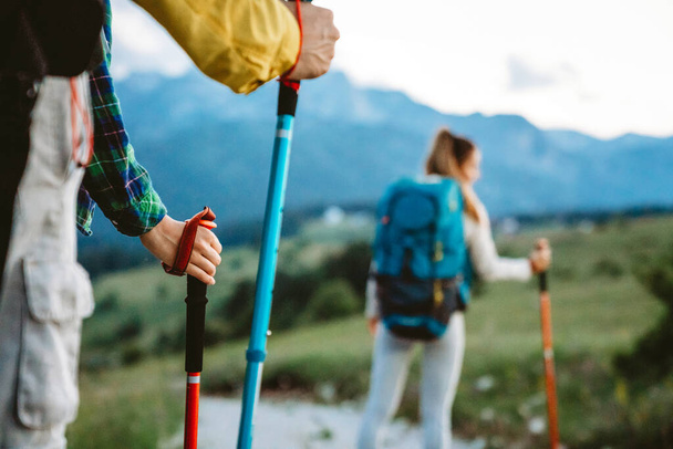 Group of friends trekking with backpacks walking outdoor - Fotoğraf, Görsel