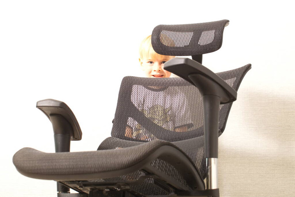 black office ergonomic chair with mesh coating. - Fotó, kép