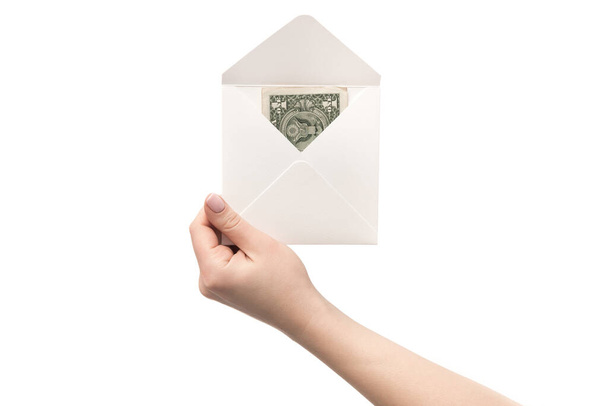 Ένας φάκελος με δολάρια στο χέρι, απομονωμένος σε λευκό φόντο. Νομισματικές παρεμβάσεις στο δανεισμό - Φωτογραφία, εικόνα