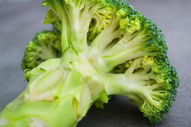 Fresh raw green broccoli on a table. Diet healthy product. - 写真・画像