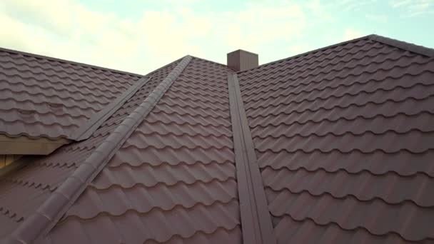 Aerial view of house roof structure covered with metal tile sheets. - Footage, Video