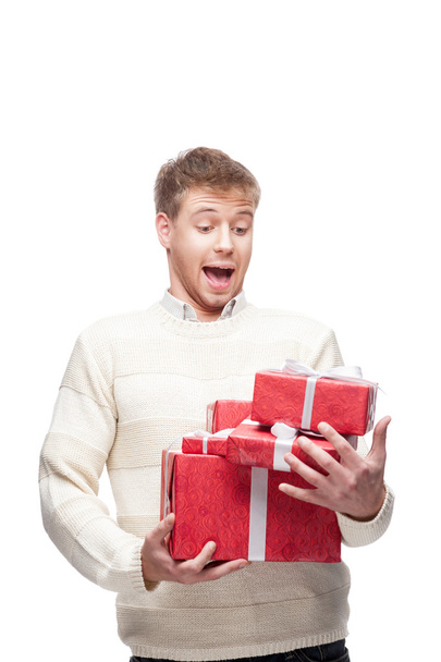 young casual man hoding christmas gift - 写真・画像